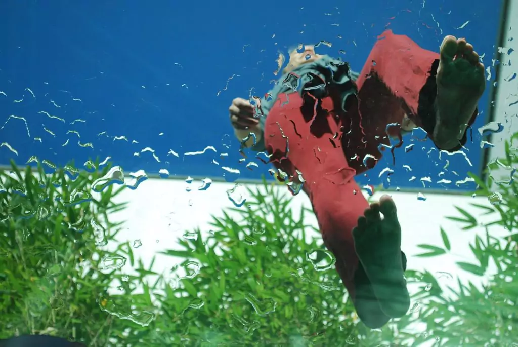 cool picture a man walking barefoot on glass floor